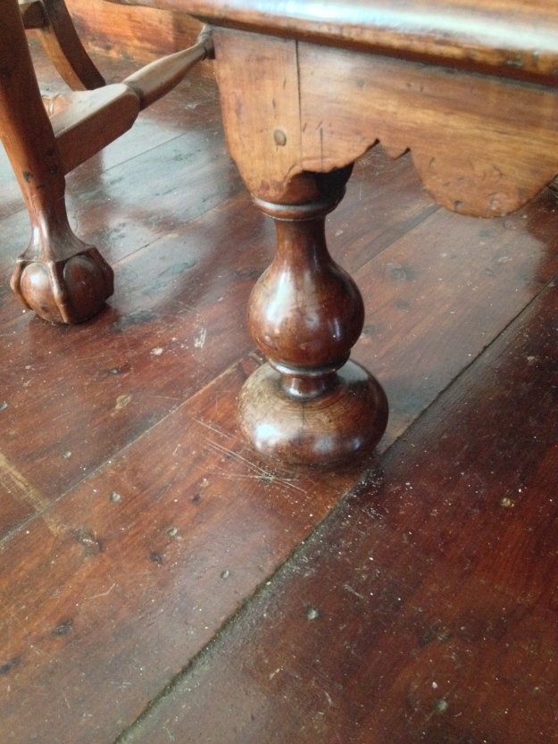 An onion foot, a sturdy base for a heavy piece of furniture, not common after 1720. 